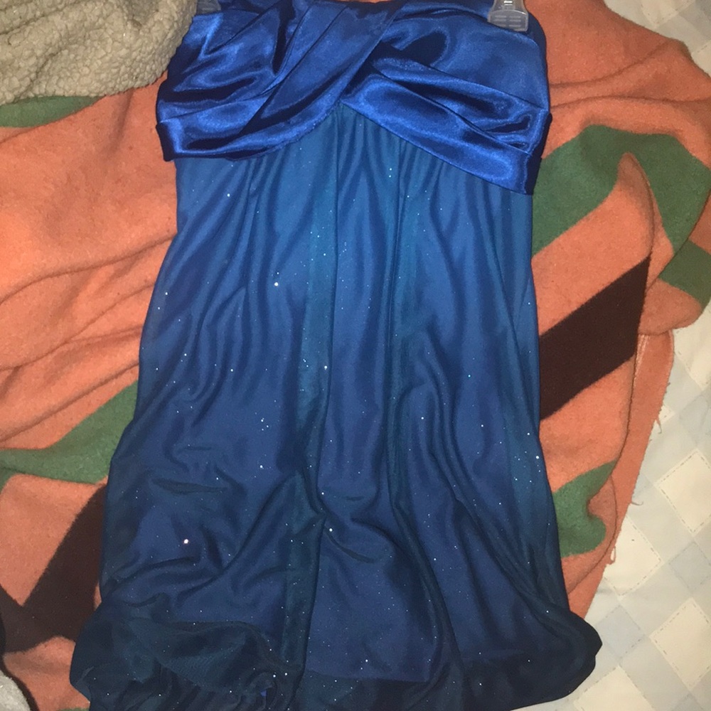 A short blue, sparkly dress